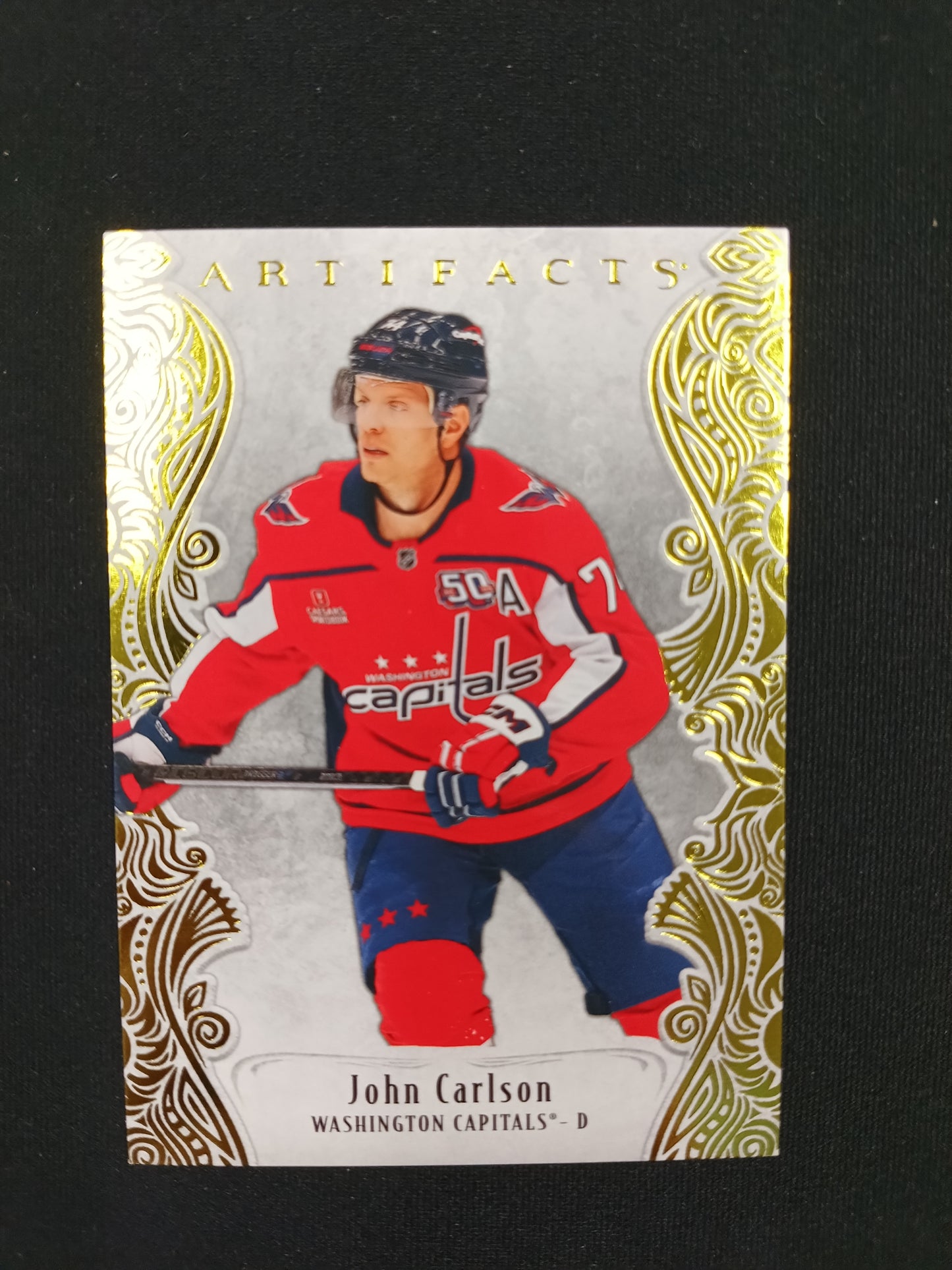 49/50 | John Carlson #116 Artifacts [Yellow]